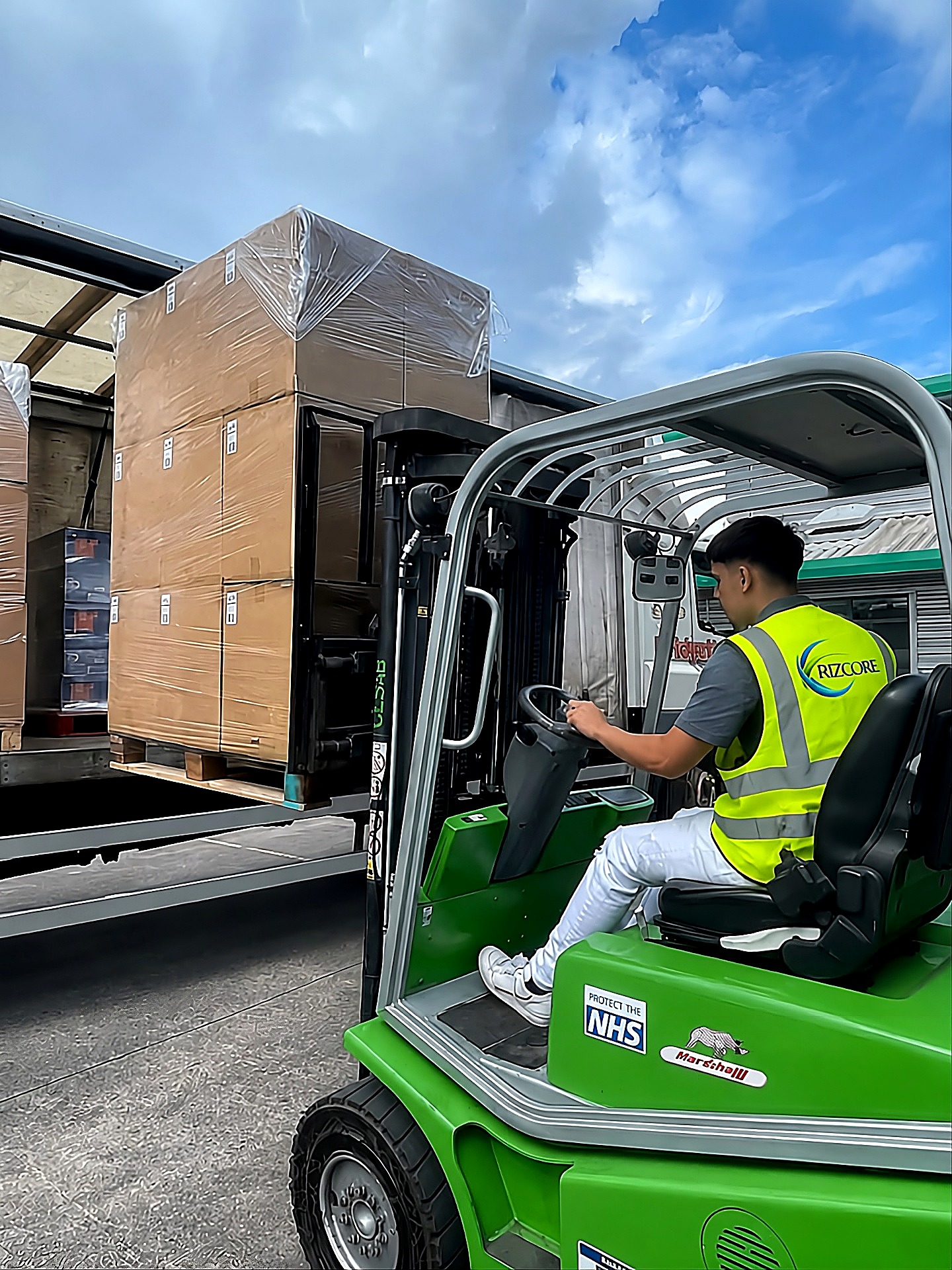 Rizcore corporate warehouse — palletized export goods and container loading in Algiers